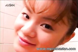 Horny Japanese coed with merry marangos lathers her body with soap seductively