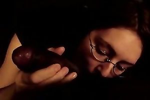 Next-door hussy wearing glasses sucks my dark boner in POV clip