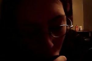 Next-door hussy wearing glasses sucks my dark boner in POV clip