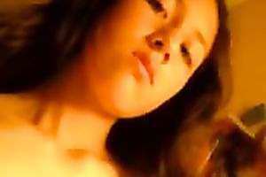 Sweet and cute Asian dark brown babe on cam flashing