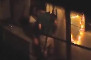Naughty pair in the next building having sex on the balcony