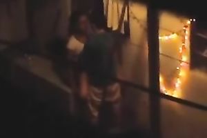 Naughty pair in the next building having sex on the balcony