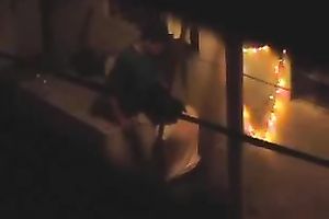 Naughty pair in the next building having sex on the balcony