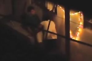 Naughty pair in the next building having sex on the balcony