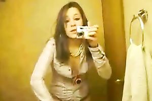 My bored brunette girlfriend in the bath taping herself