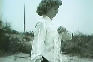 Retro golden-haired babe disrobes outdoors and shows her worthy body