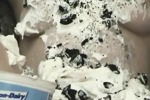 Brown-haired floozy decorates her body with whipped jizz