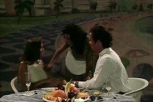 Retro clip with an alluring chick engulfing a pecker at the dinner table