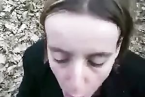 Shamelessly exhibitionistic whore is engulfing my shlong in the woods