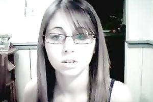 Amateur gal in glasses shows her attractive jugs for the webcam