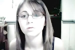 Amateur gal in glasses shows her attractive jugs for the webcam