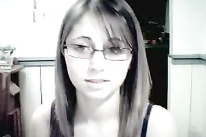 Amateur gal in glasses shows her attractive jugs for the webcam