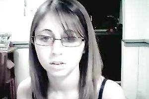 Amateur gal in glasses shows her attractive jugs for the webcam
