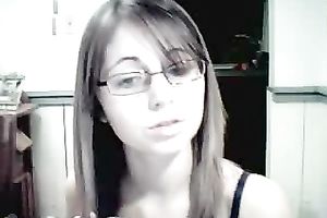 Amateur gal in glasses shows her attractive jugs for the webcam