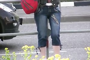 Spoiled brunette hair Tanya pees her capris in the street