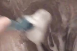 Wife of ally shaves her hairy fanny in the shower and pokes it with dildos