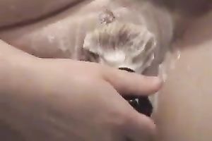 Wife of ally shaves her hairy fanny in the shower and pokes it with dildos