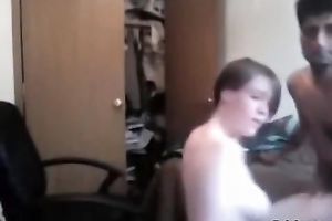 Slutty brown-haired teen sucks her exotic BF's schlong and rides it