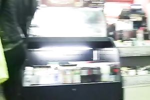 Brunette cutie in legging teases me with her arse in a store