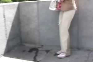 Redhead dilettante skank pees in her panties on the sidewalk