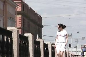 Amateur dark brown Russian playgirl in white shorts piddles in public