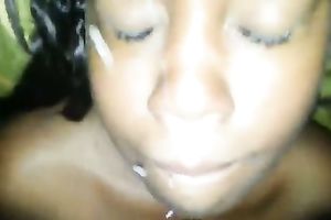 Hussy ebon chick receives her face sprayed with cum