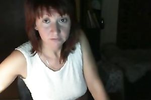 Red-haired Russian nympho in denim shorts likes masturbating on webcam