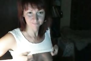 Red-haired Russian nympho in denim shorts likes masturbating on webcam