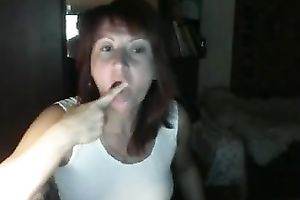 Red-haired Russian nympho in denim shorts likes masturbating on webcam