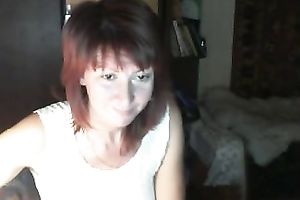 Red-haired Russian nympho in denim shorts likes masturbating on webcam