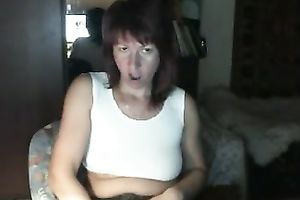 Red-haired Russian nympho in denim shorts likes masturbating on webcam