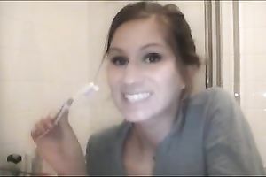 Nasty gal plays with her bazookas whilst cleaning her teeth