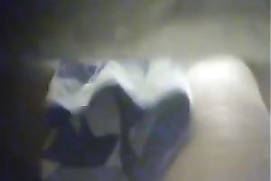 Curvaceous dark brown honey puts on her garments in locker room