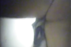 Curvaceous dark brown honey puts on her garments in locker room