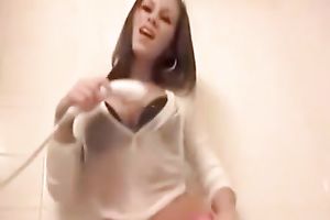 Buxom gal in fishnet nylons likes showering with garments on
