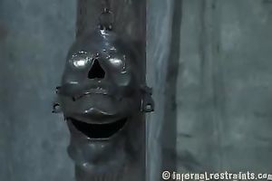 Salacious dark brown honey sucks a sex toy attached to pillar