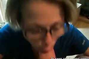 Cute blond in glasses acquires a cum facial in her dining room