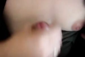 Jerking off a knob on titties and sperm on 'em