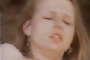 Two excited women ride one well endowed fellow in a forest