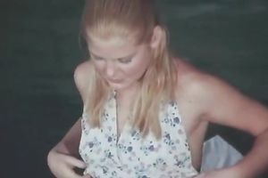 Petite blond sweetie in the pool is already in nature's garb