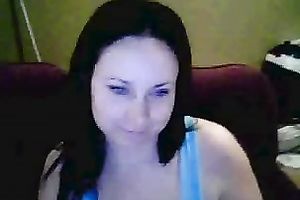 Amateur brunette hair hussy shows her breasts and pierced tongue