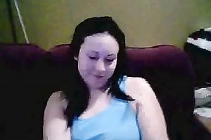 Amateur brunette hair hussy shows her breasts and pierced tongue