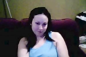 Amateur brunette hair hussy shows her breasts and pierced tongue