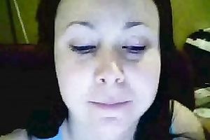 Amateur brunette hair hussy shows her breasts and pierced tongue