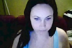 Amateur brunette hair hussy shows her breasts and pierced tongue