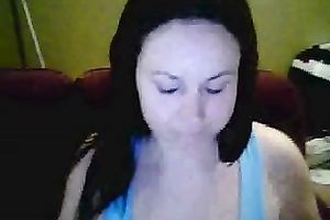 Amateur brunette hair hussy shows her breasts and pierced tongue