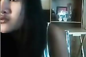 Dark skinned Asian web camera legal age teenager shows me her pretty mangos