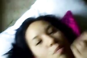 Brunette cutie lies in front of me during the time that I splatter her face with cum