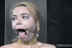 Sweet blond playgirl with cute face has a ring gag in her throat