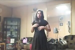 Amateur dark brown disrobes down to her underware in homemade solo movie